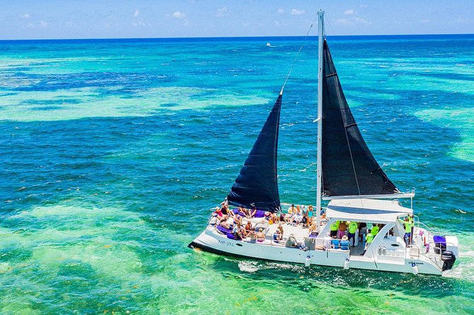 Catamaran Cruise with Snorkeling & Parasailing - The Party Cruise Feel: Open Bar, Music, and How to Time Your Fun